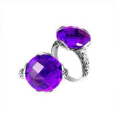 Handcrafted sterling silver Bali ring with faceted round Amethyst Quartz and scroll-carved band.